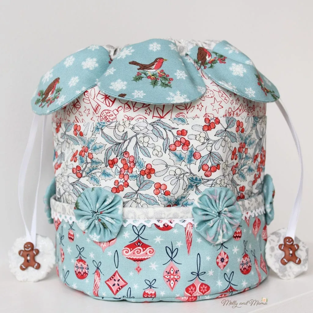 Drawstring dilly bag sewing pattern with fabric petals, pockets and yoyos